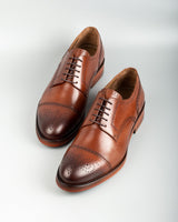 Chelia · derby · cognac