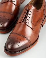 Chelia · derby · cognac
