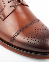 Chelia · derby · cognac