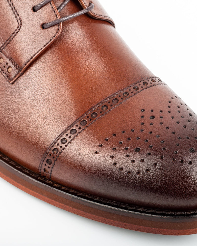 Chelia · derby · cognac